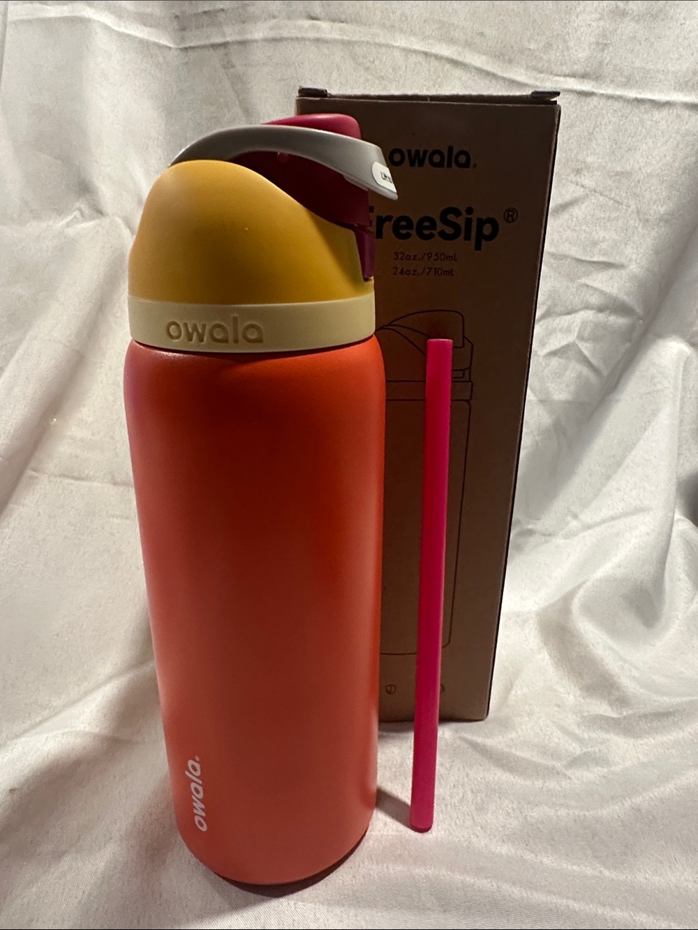 Owala insulated water bottle with a built-in straw. Citrus Crush 32oz